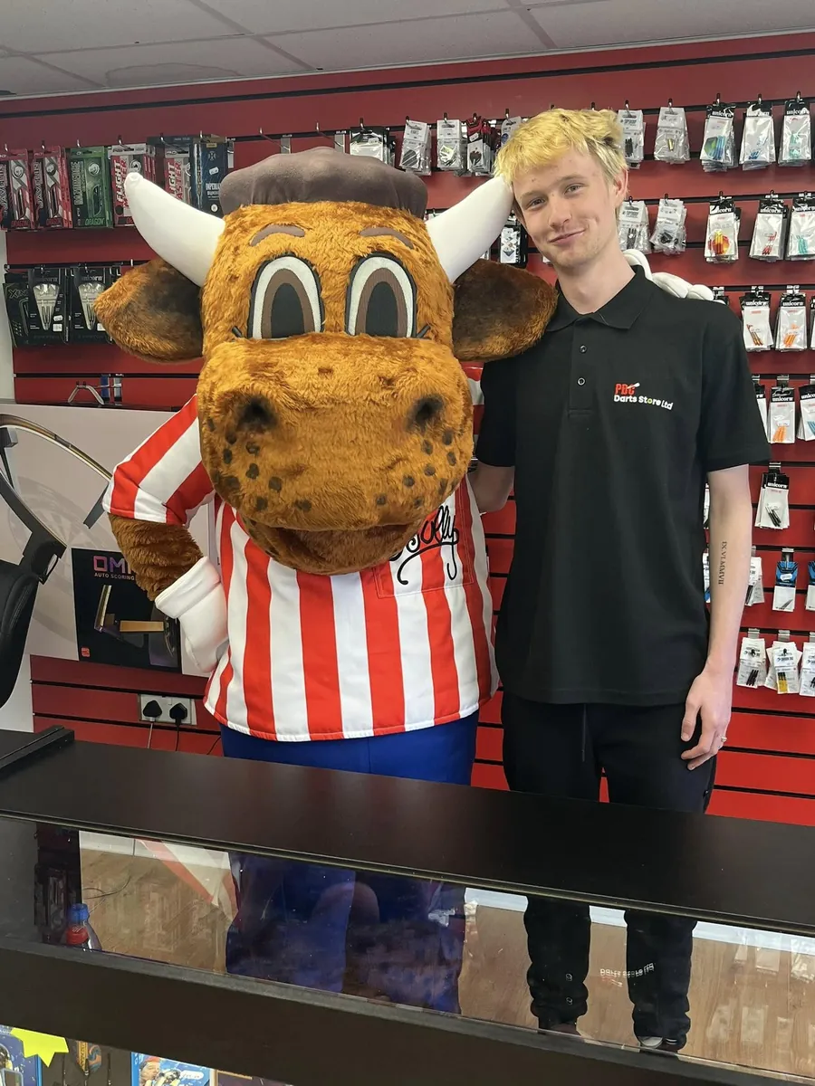Andy and Alison in PBC polo shirts with Bully, in the shop’s practice area